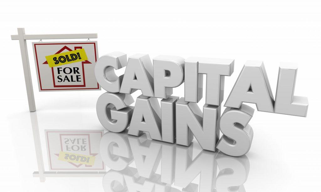 Image of Capital Gains in big 3D writing with a for sale sign